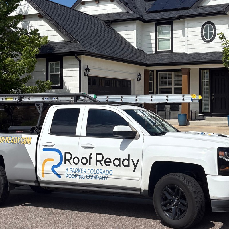 Licensed roofing crew replacing shingles on Parker Colorado home