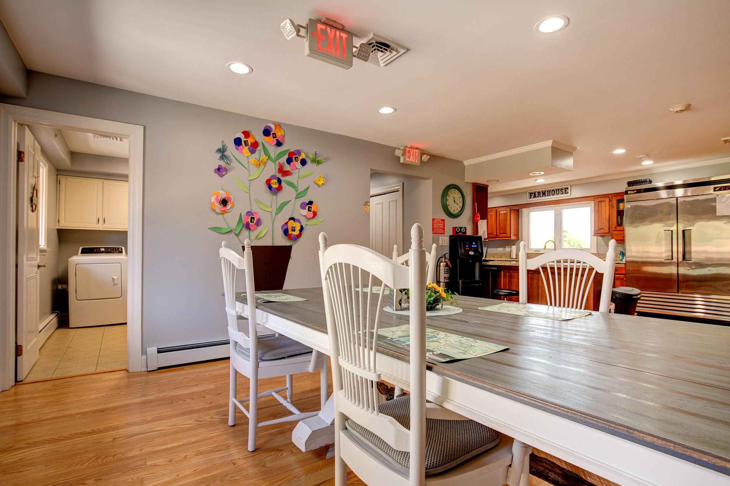Doctor consulting with an elderly patient in an office.