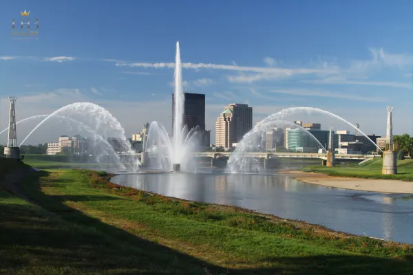 Dayton Ohio skyline with fountain and bridge, LH3 executive and group travel services"