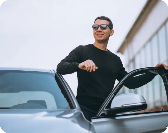 Man walking near luxury loaner car provided by LH3 concierge service"