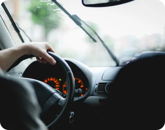 Steering wheel close-up representing LH3 at-home test drive and delivery service"
