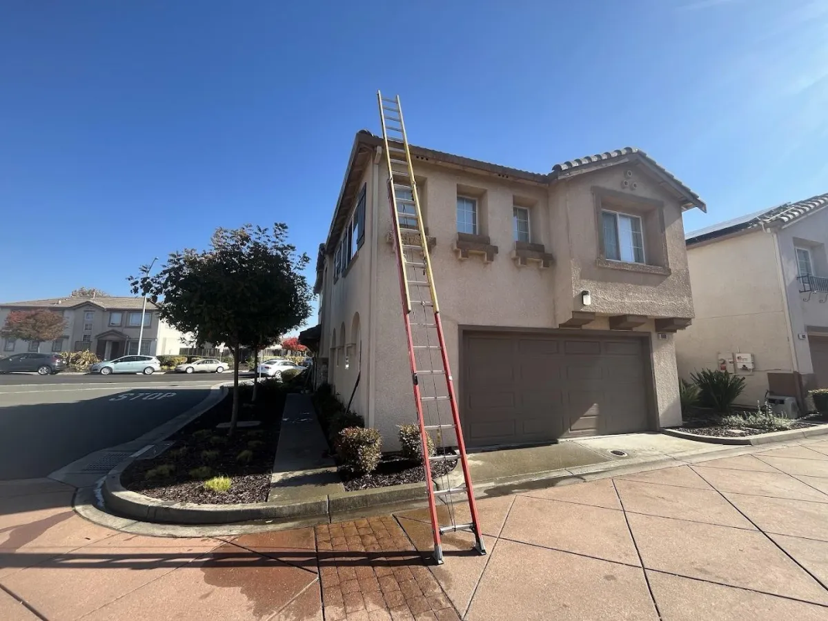 Window cleaning ladder setup two-story residential home Solano County professional exterior window cleaning service