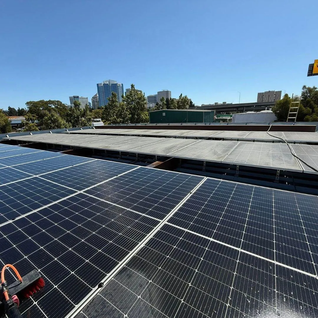Professional solar panel cleaning service technician cleaning rooftop solar array Solano County Teodor Window Solar