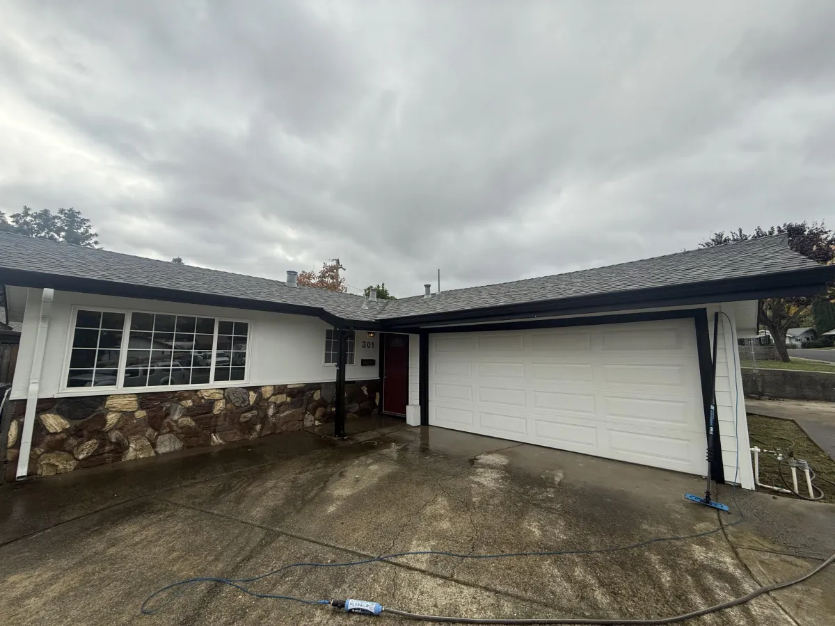 Clean residential gutter preventing water damage roof edge Solano County professional gutter cleaning service