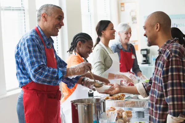 volunteers serving food