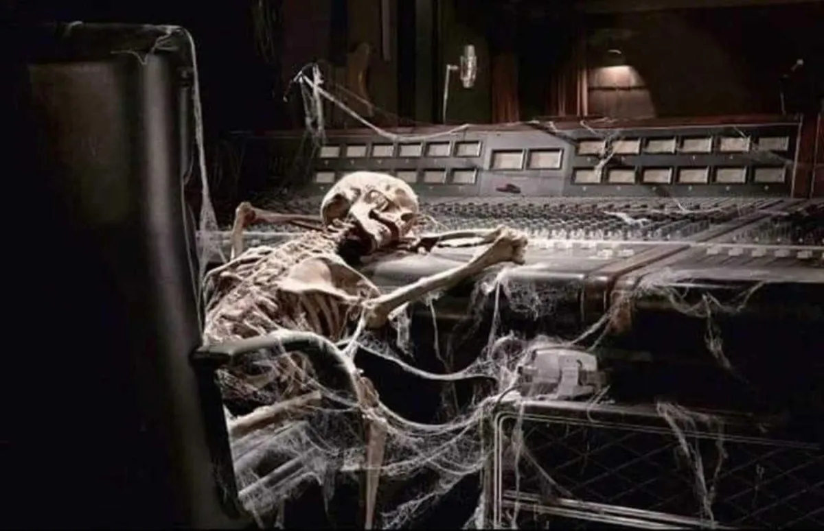 Humorous image of a skeleton at a soundboard, representing tech overwhelm