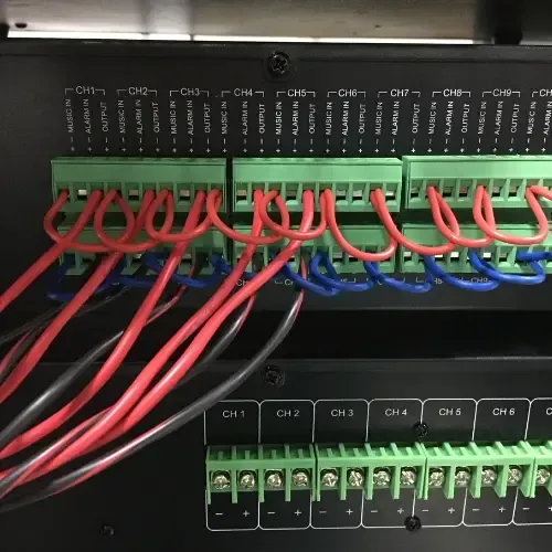 Audio engineer reviewing signal flow and system layout during a church sound assessment