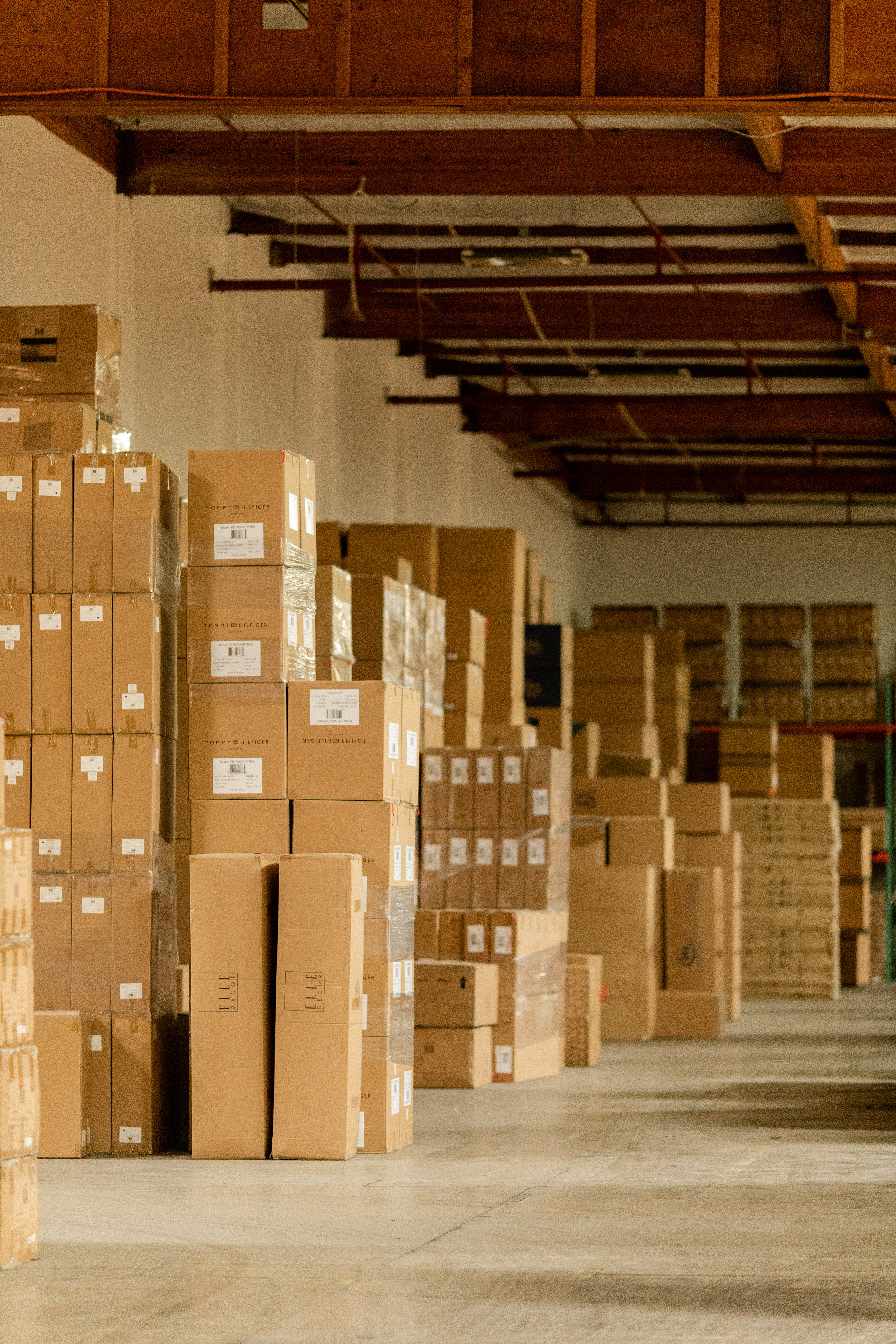 Rows of palletized cardboard boxes stacked high in GSW 3PL warehouse — bulk storage and inventory management