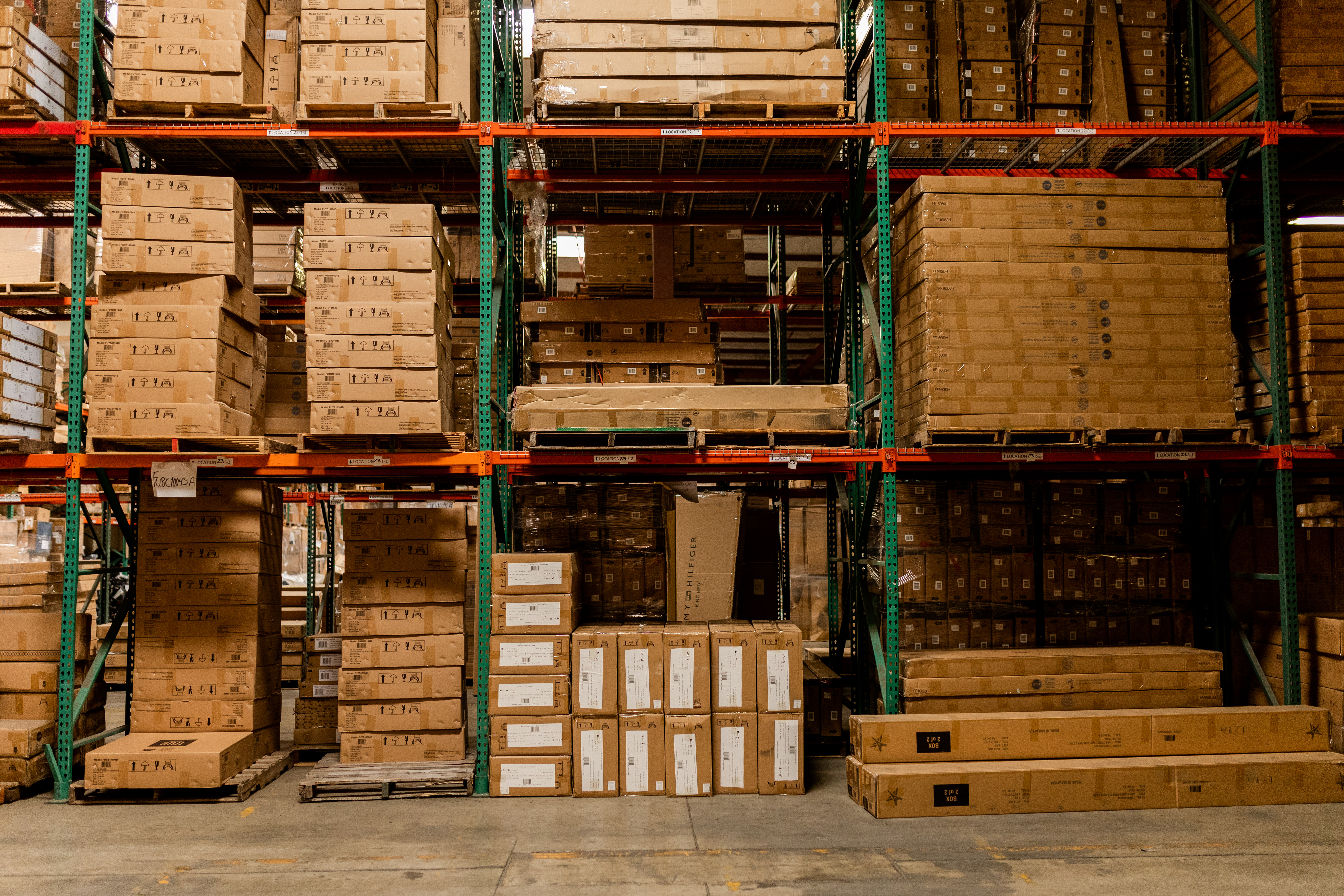 GSW 3PL big and bulky warehouse — high-bay green and orange pallet racking system storing oversized freight, furniture boxes, and large-format goods at GSW Oxnard California facility