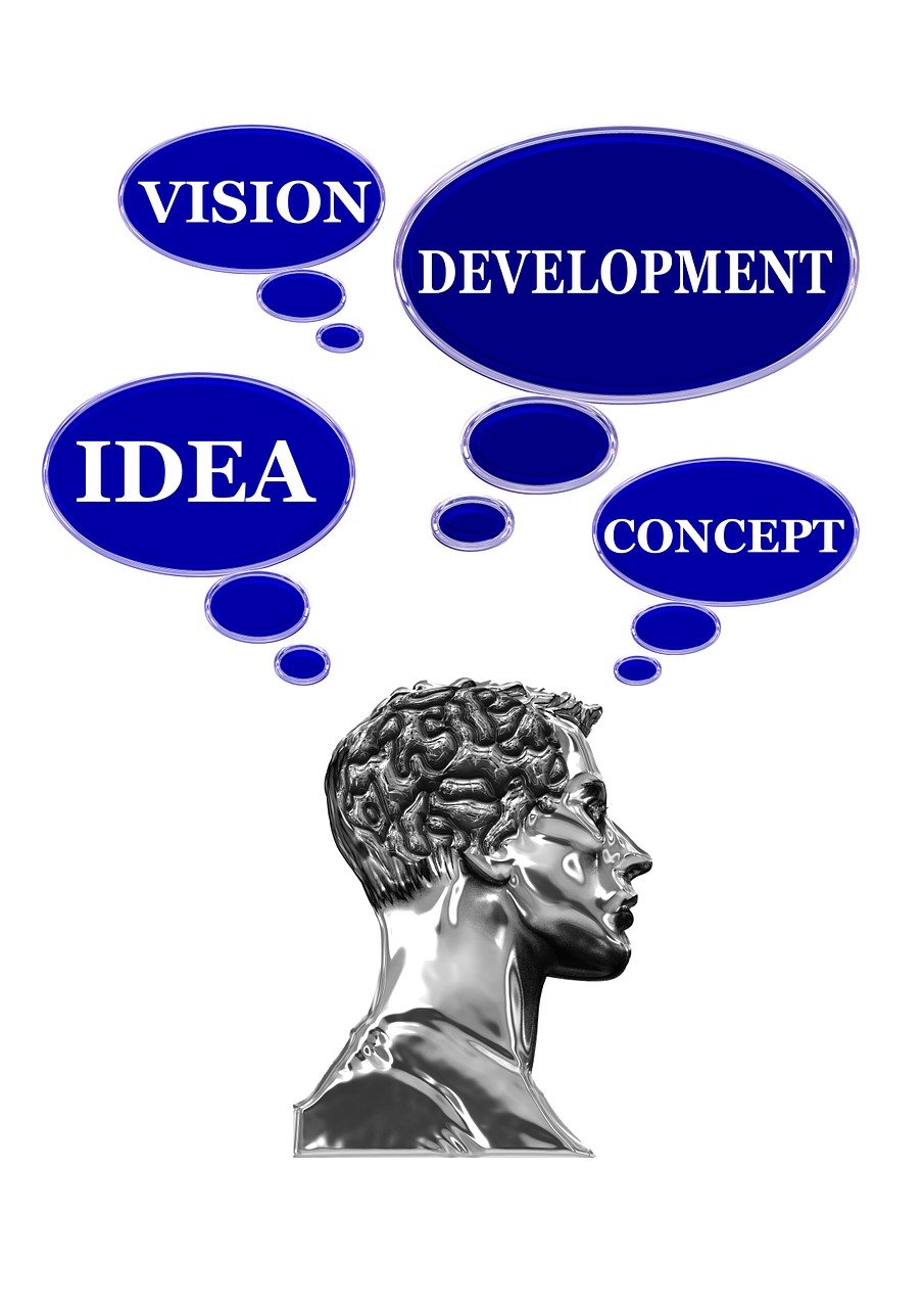 Grey statue head with 4 blue thought bubbles. Each bubble has 1 word in it. The words are idea vision development and concept.