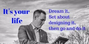 Black and white image of founder looking at a tablet, with sky and trees in the background. Words written on picture either side of person that say, It's your life. Dream it, set about designing it, then go and do it. 