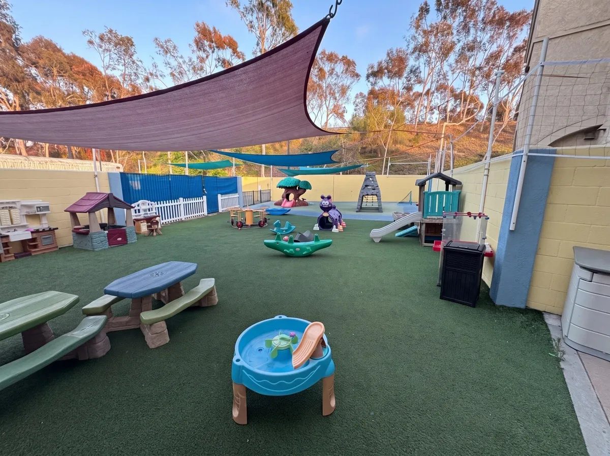 Shade sails over the turf playground at Sunny Cove Preschool Oceanside