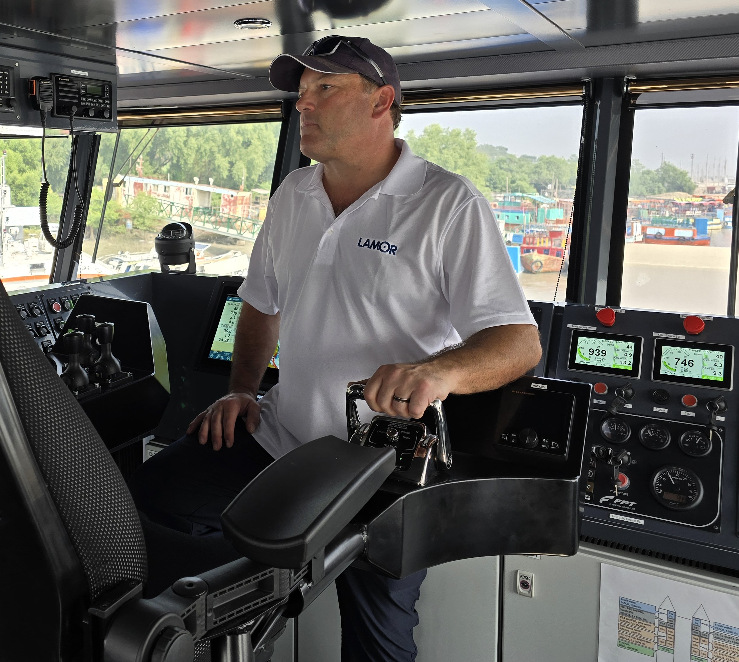 Professional framed photo of Captain John K. Parker at the helm