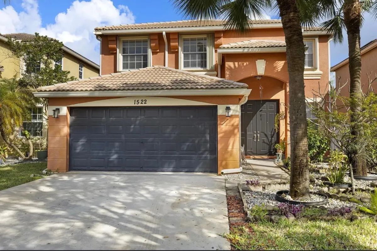a living room filled with furniture and a fire place