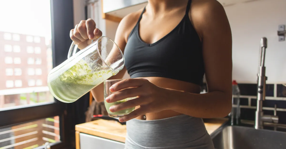 woman pouring a detox drink