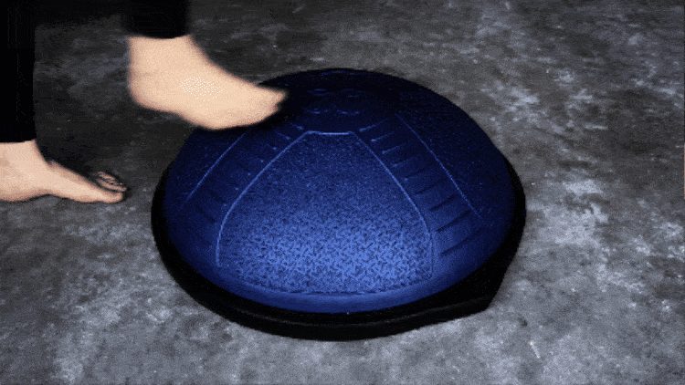 Course Feature, person balancing on an inflatable fitness device.