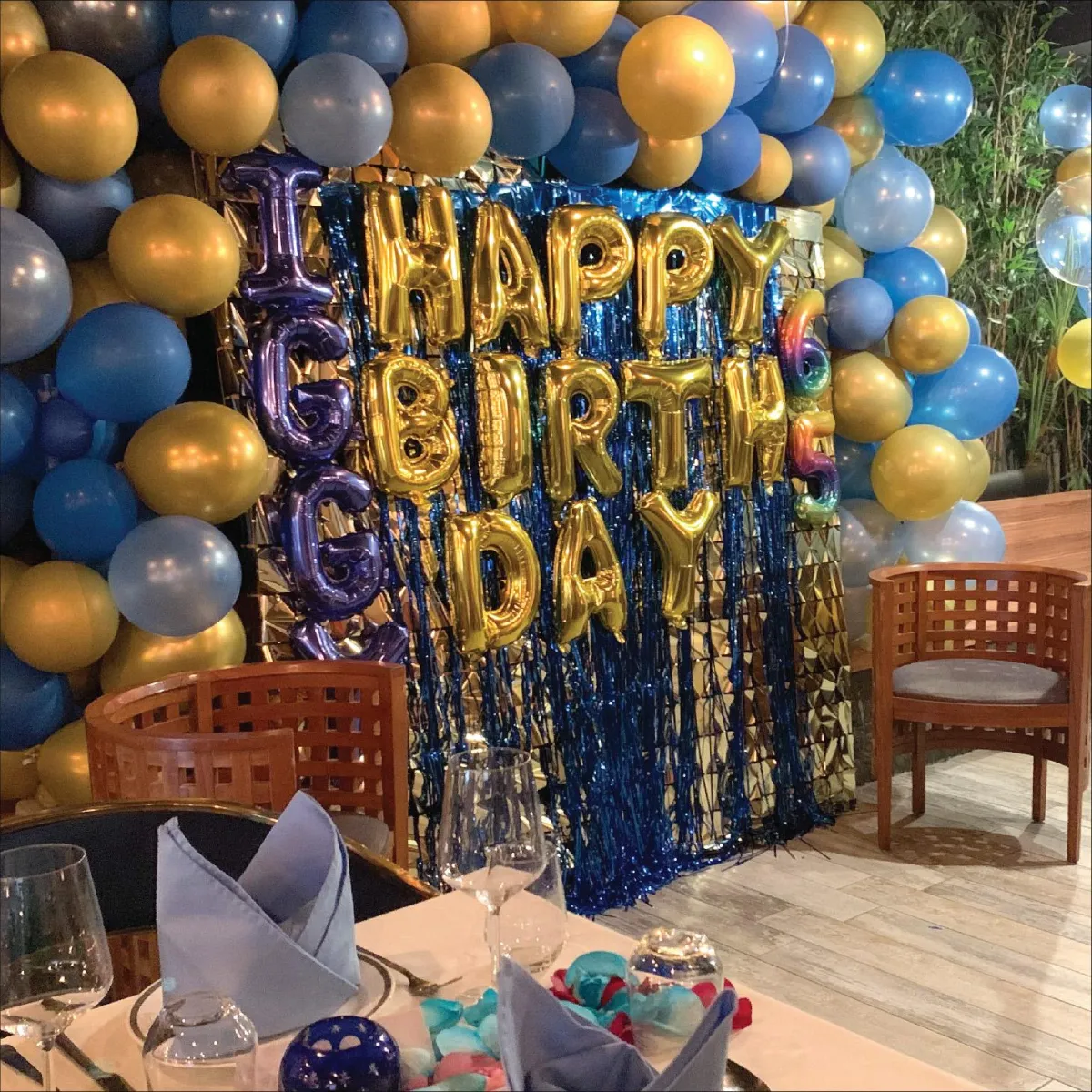 Happy Birthday balloons and glittering wall decorations for a birthday party at R Italian Kitchen & Smokehouse.