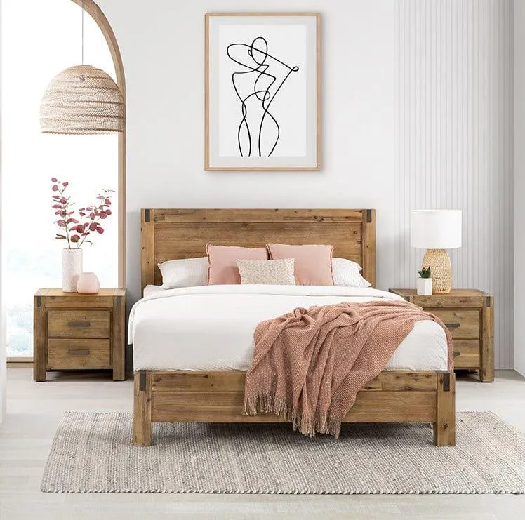 A bedroom group featuring a timber bedframe, lamps linen and a queen Sleepmaker mattress