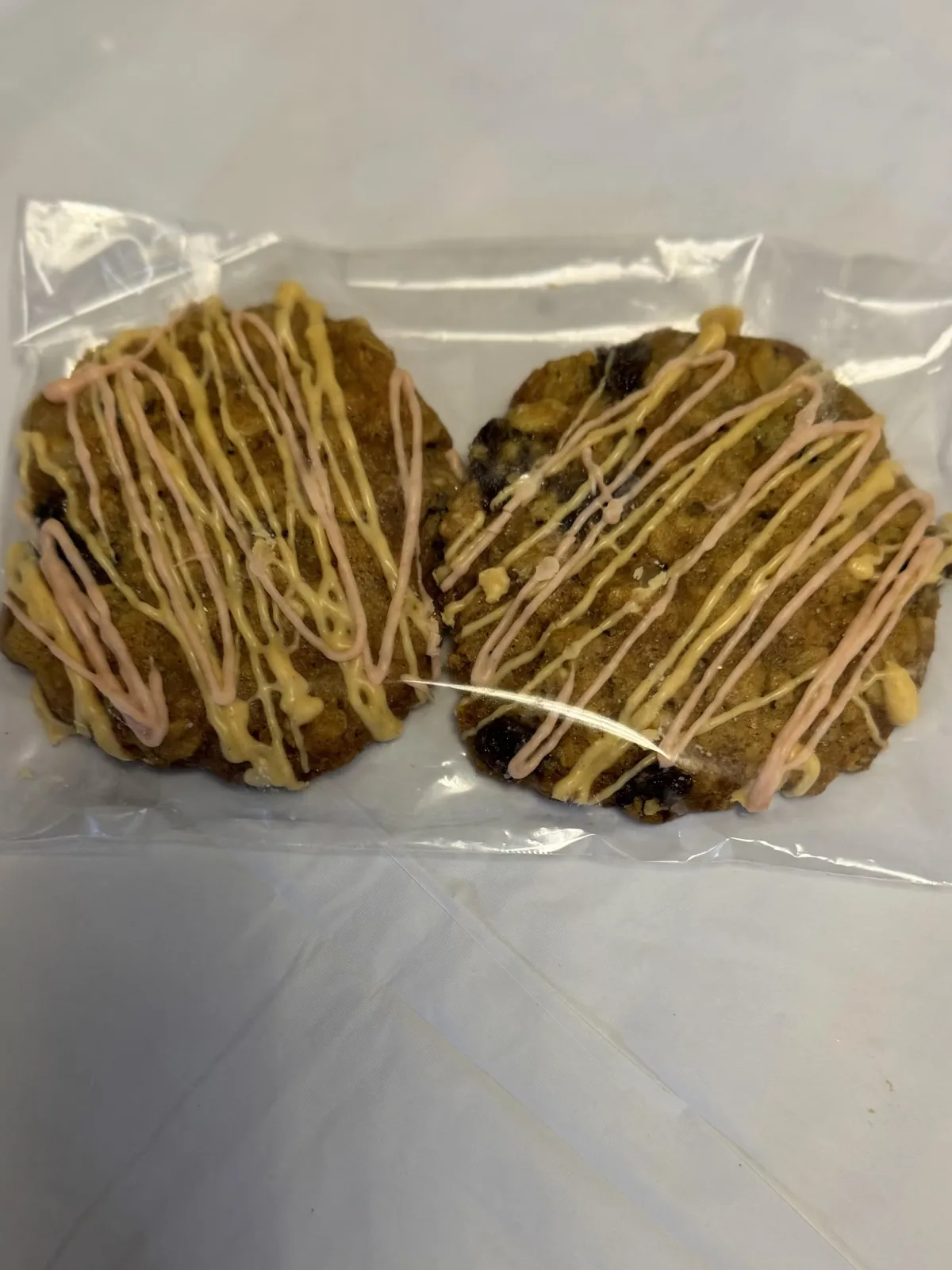 a tray of cookies decorated with white icing