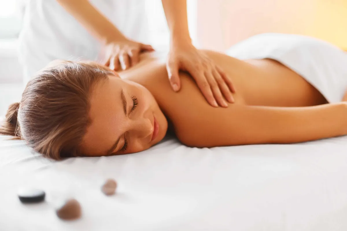 Therapist using a combination of deep tissue and stretching techniques