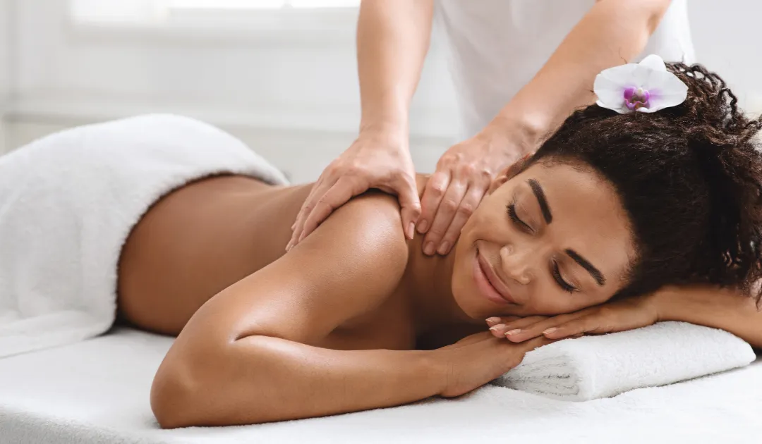 Massage bed prepared for full body treatment in spa room
