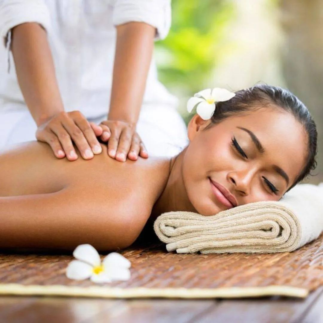 Woman enjoying head-to-toe massage therapy session for stress relief