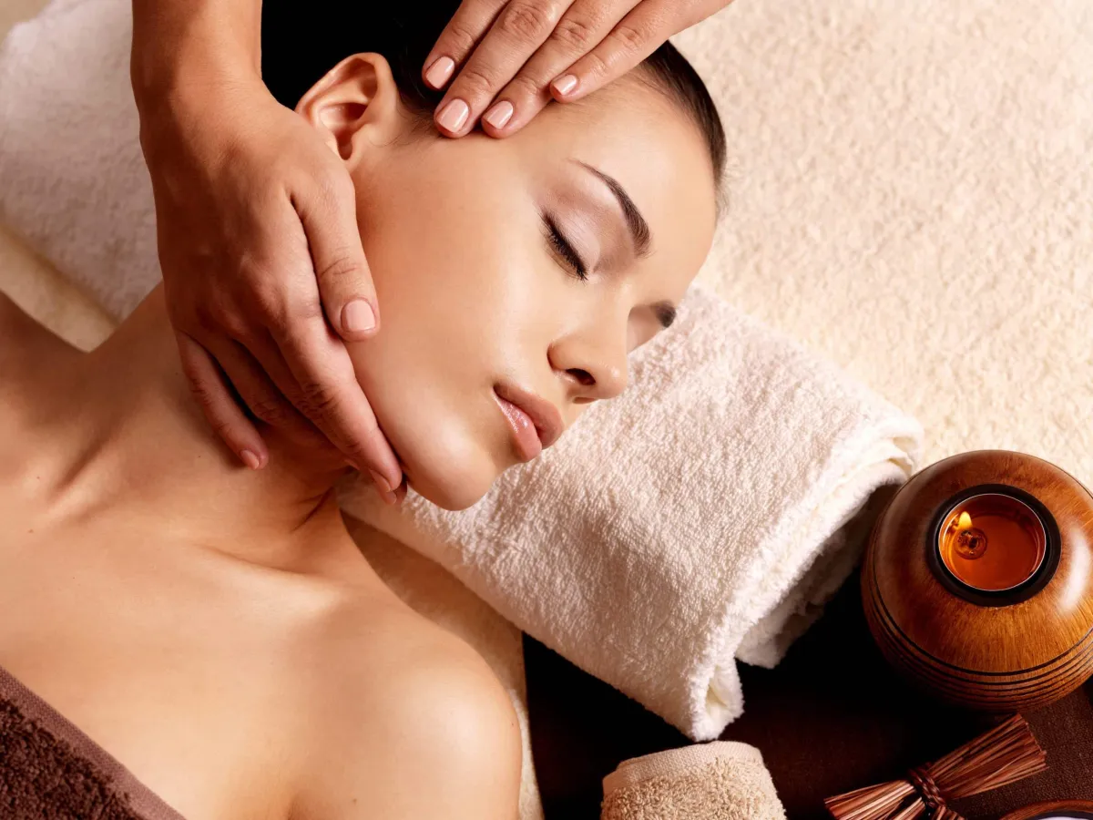 Therapist performing neck and shoulder massage for stress relief