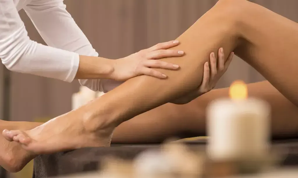 Client receiving relaxing foot massage therapy