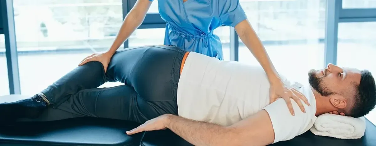 Client receiving glute and lower back massage for sciatica
