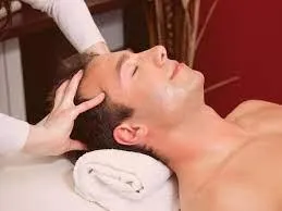 Client receiving massage for tension headache at K Spa