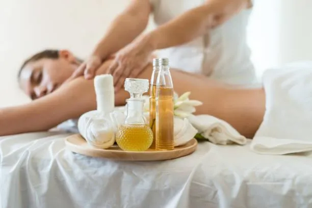 Therapist applying essential oil during relaxing massage