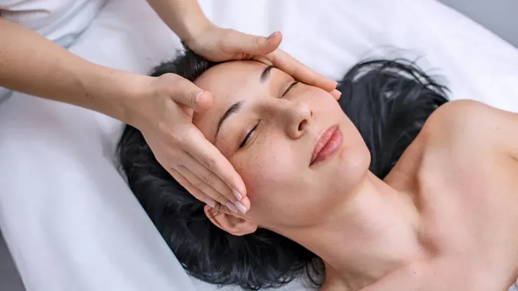 Client receiving supportive massage during cancer recovery