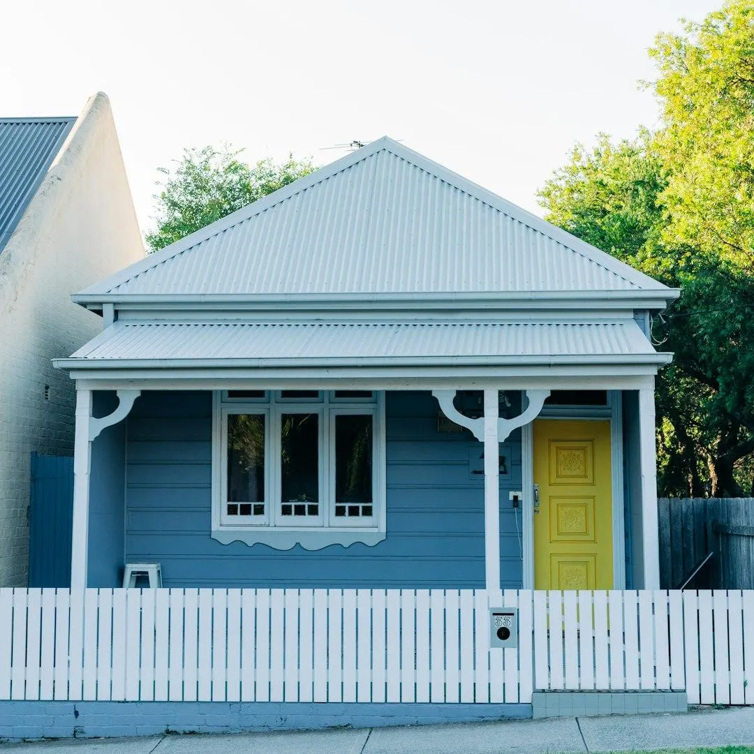 small blue house with white colorbond roof