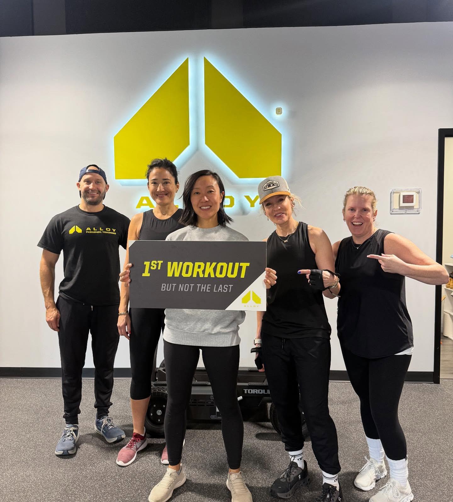 Asian Female Member after he first workout at alloy personal training lincoln park in chicago