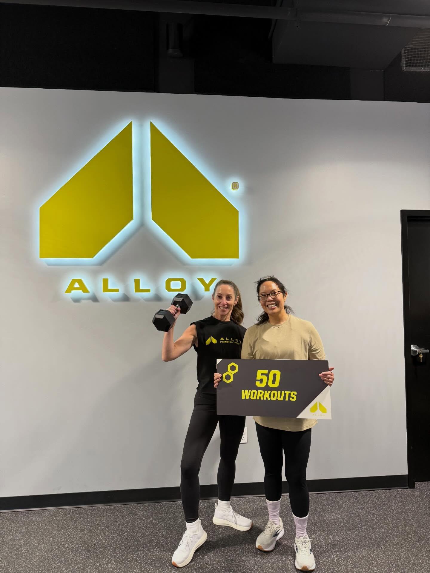 Female Member after her 50th workout at Alloy Personal Training Lincoln Park in Chicago with her Certified Personal Trainer