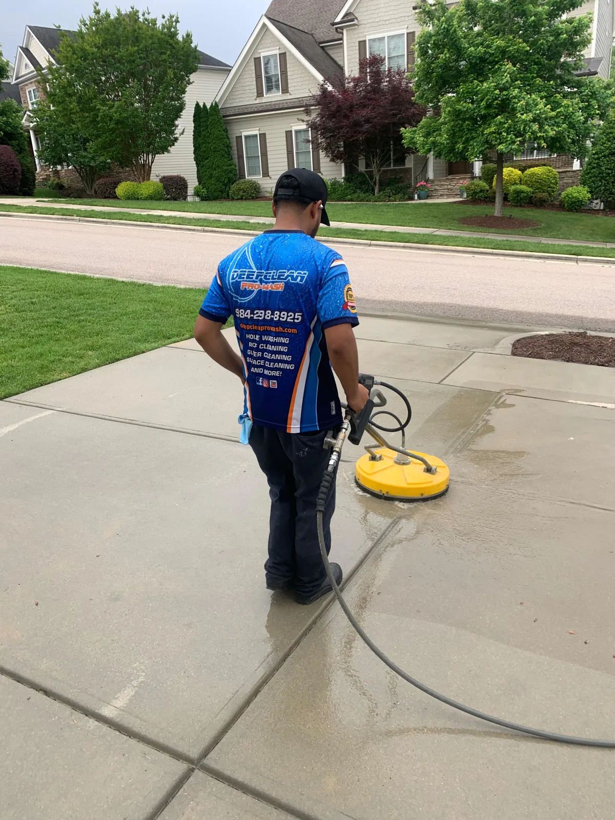 Surface cleaner washing residential concrete driveway