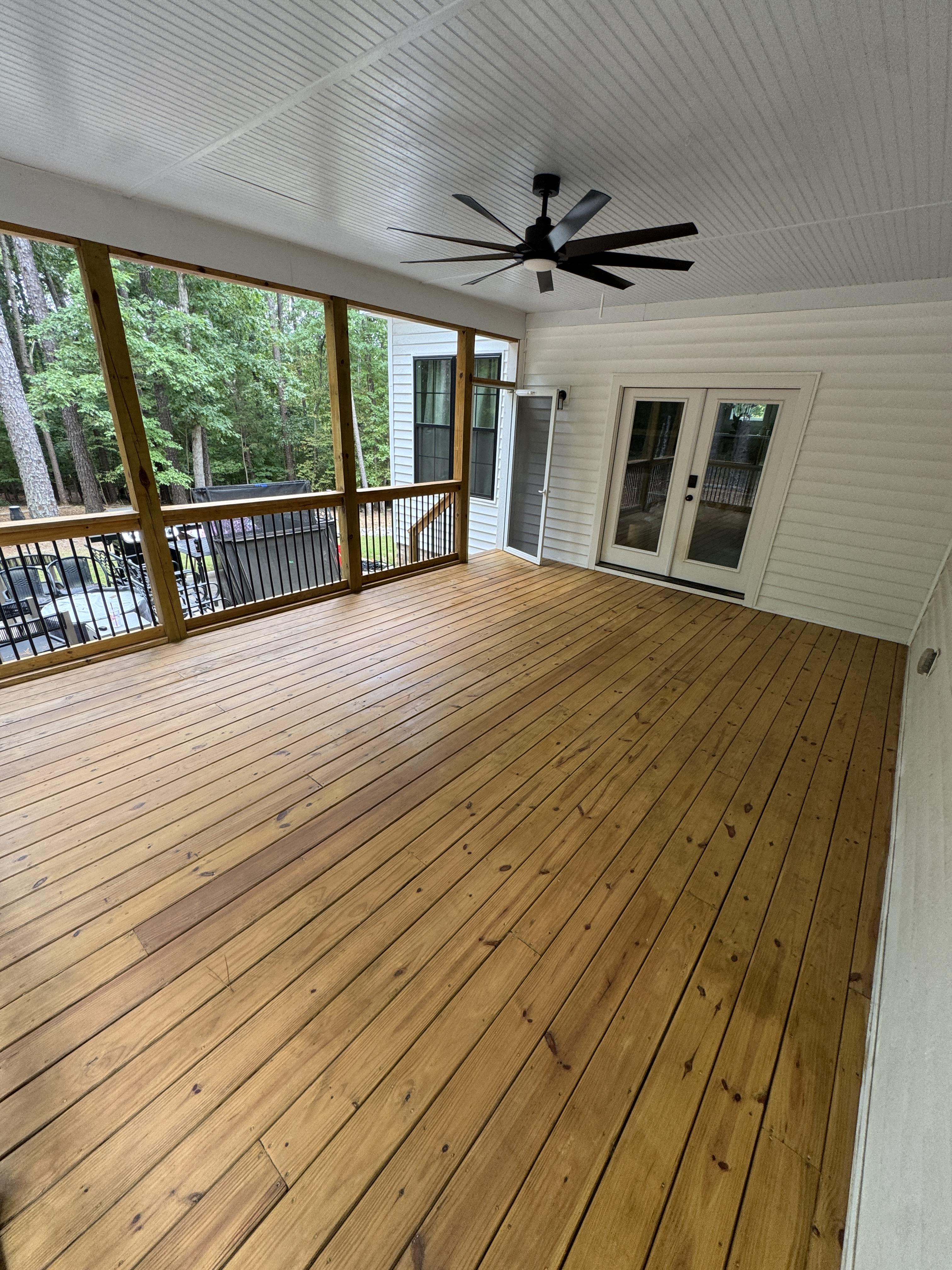 "Professional deck and fence staining services in Raleigh, NC by Deep Clean Pro-Wash."