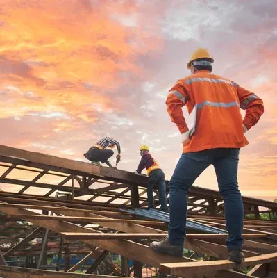 Team of roofers replacing entire roof