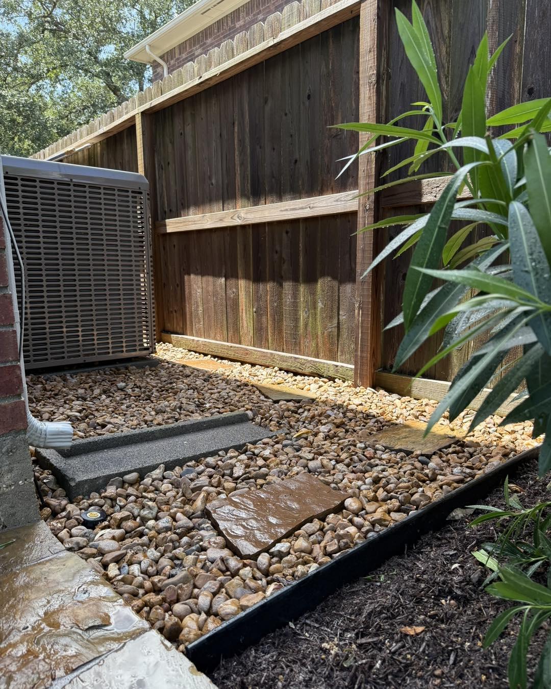 French drain installation with drainage pipes in a residential yard