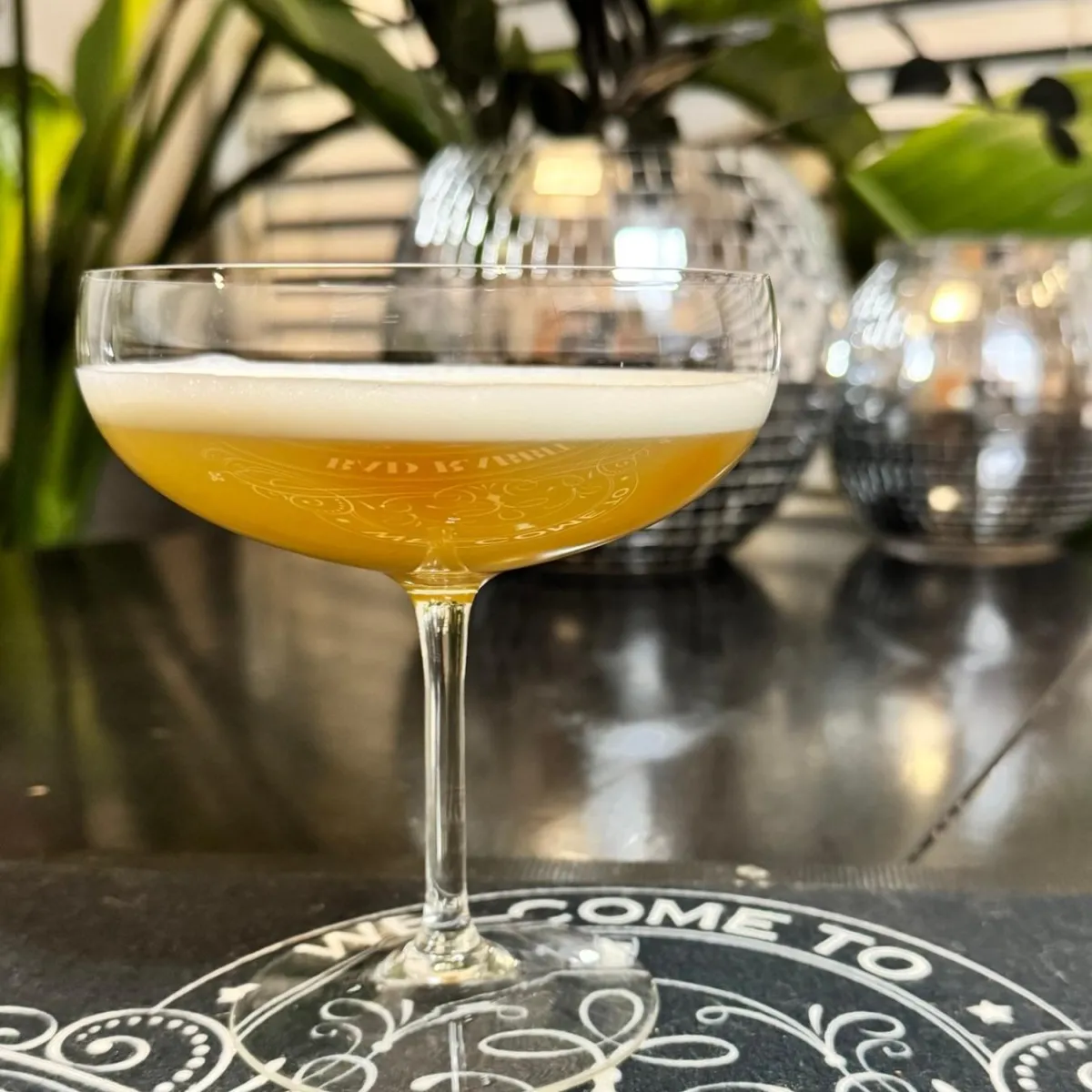 Signature cocktail served in a coupe glass for Denver cocktail catering and mobile bar service