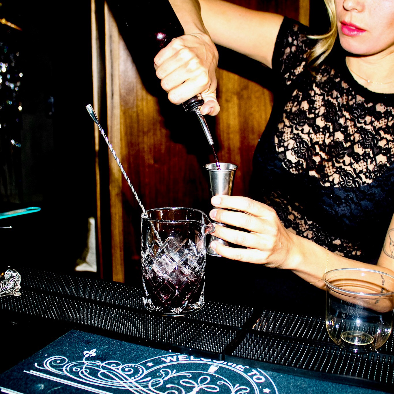 Mobile coffee catering Denver with bartender pouring a handcrafted cocktail at an event bar setup