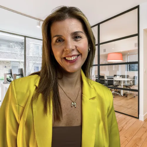 a body of water with mountains in the background