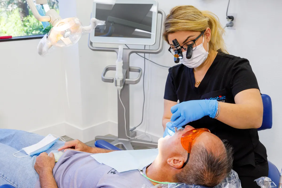 Dr Babrood Working on Patient 