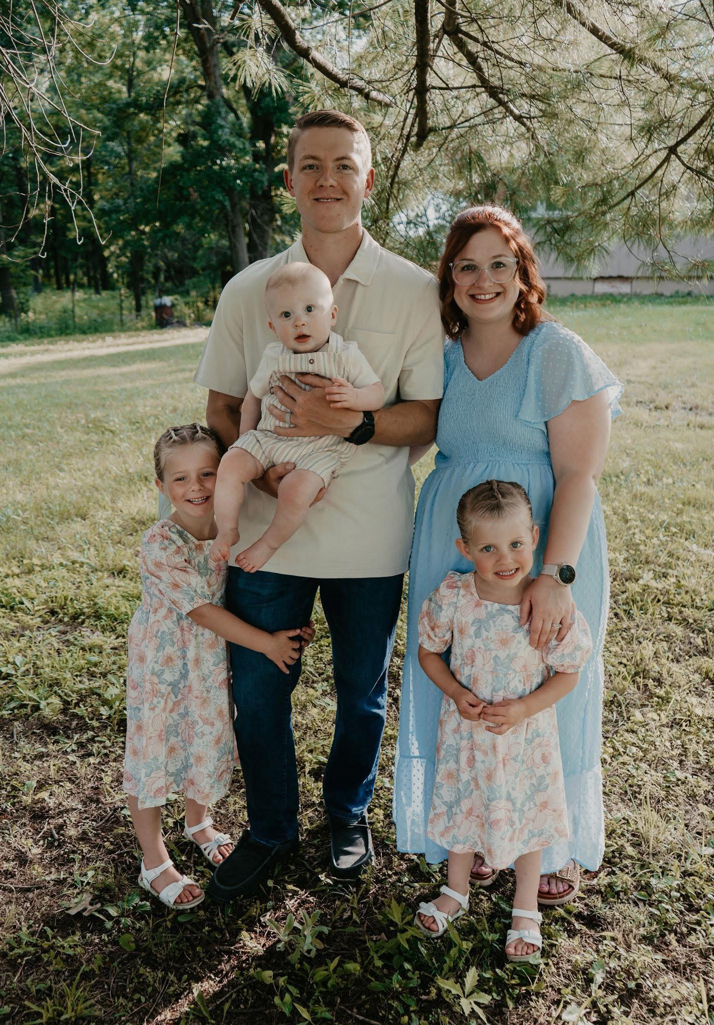 A professional installation team setting up office furniture in a bright, organized workspace. The team is diverse and focused, working efficiently together.