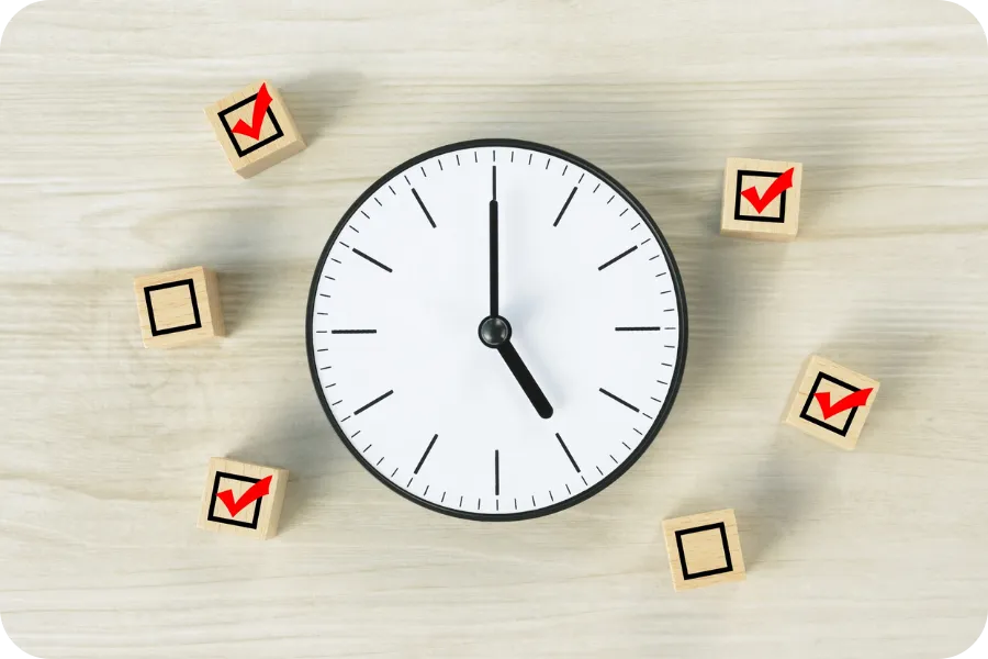 Clock surrounded by checkmark icons.”