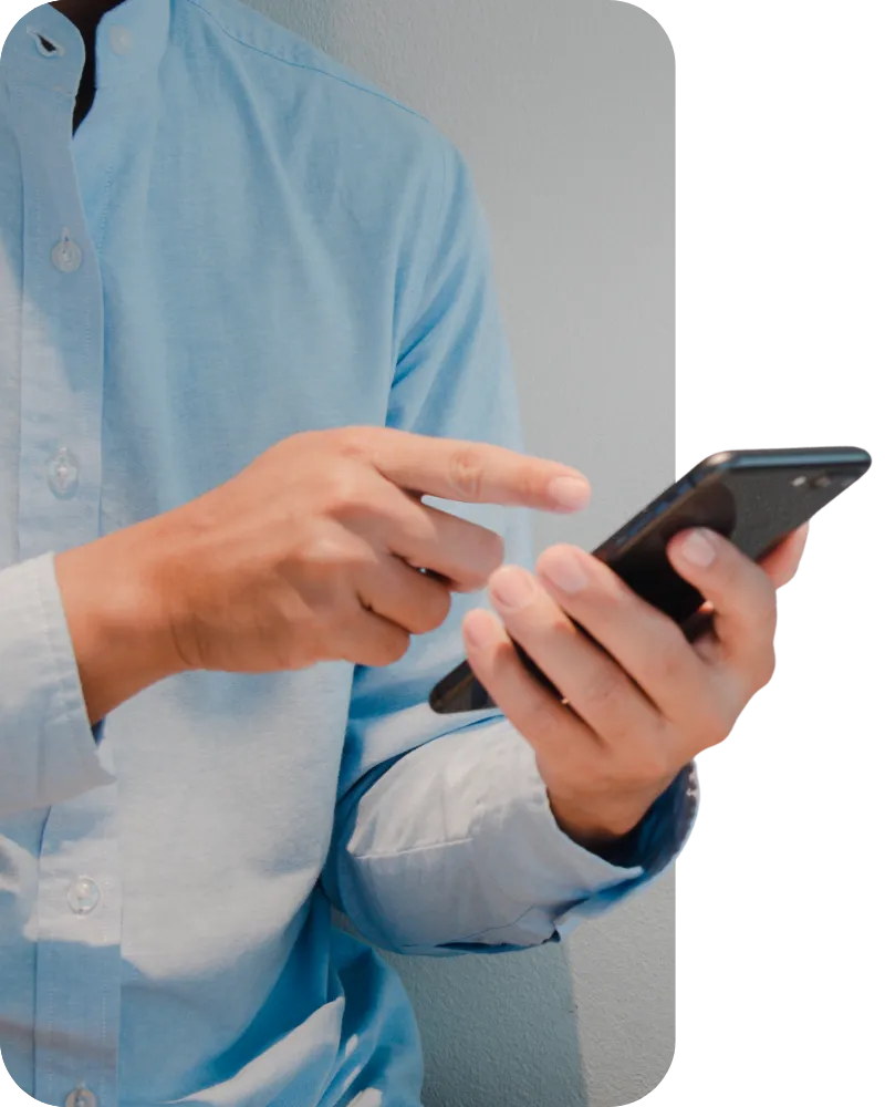 Person holding and using a smartphone.