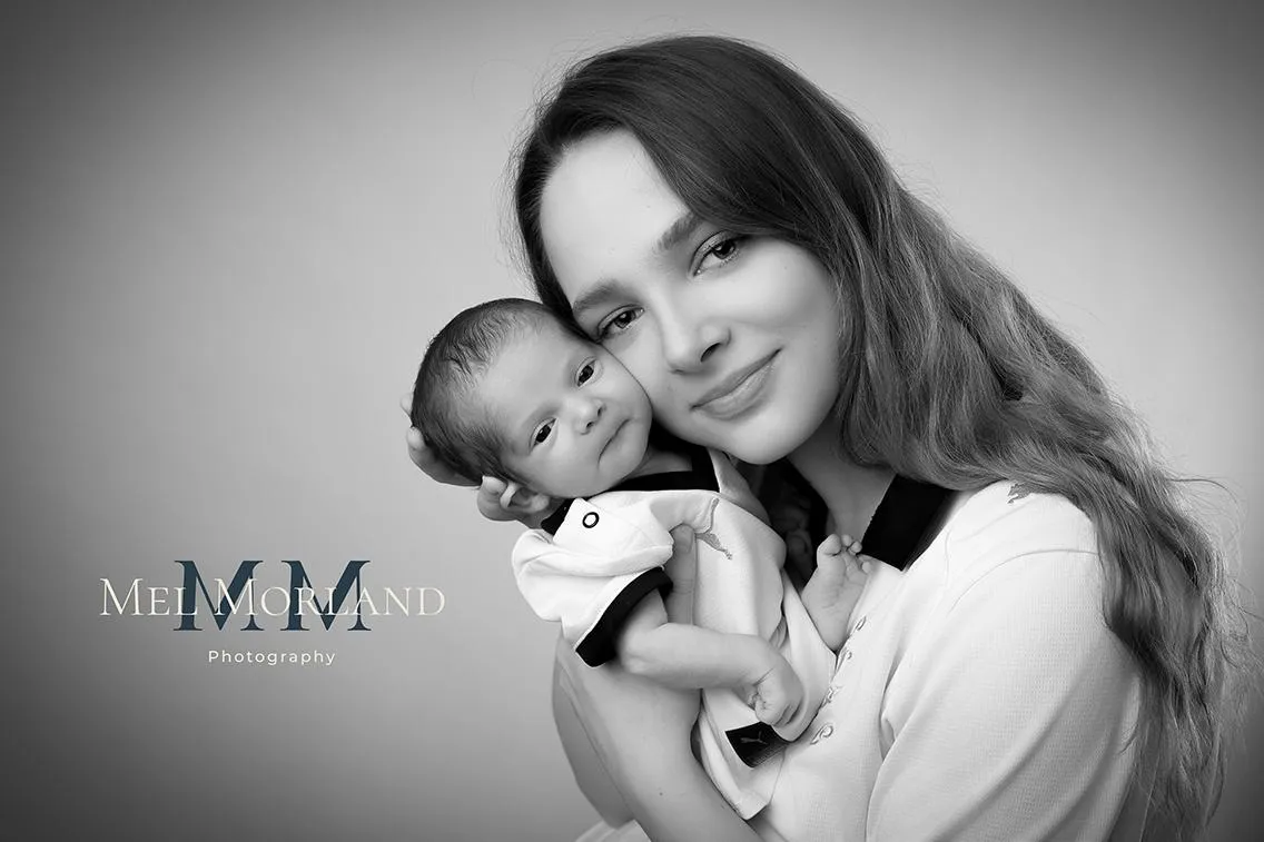 Peaceful newborn portrait in soft neutral tones