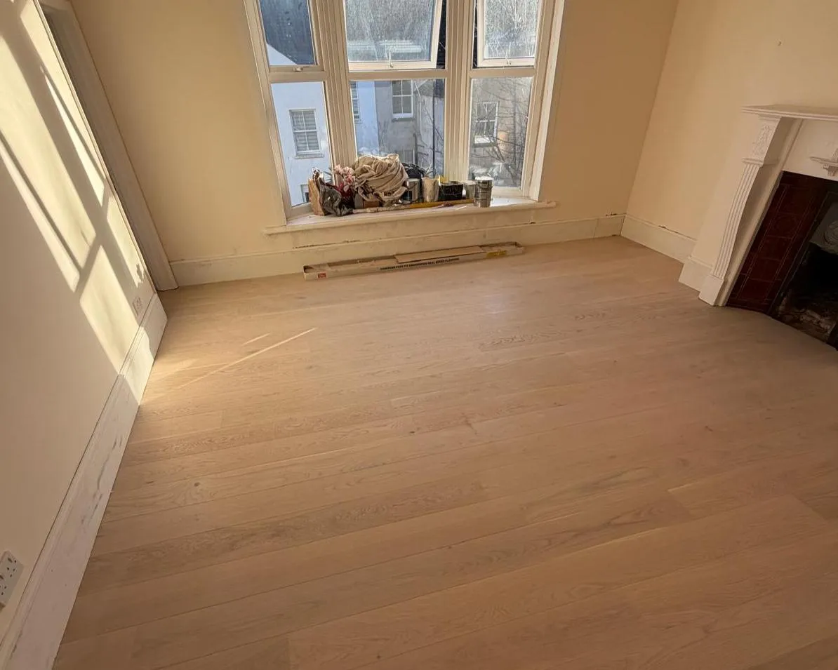 Floor installation in Hove with engineered oak boards being laid