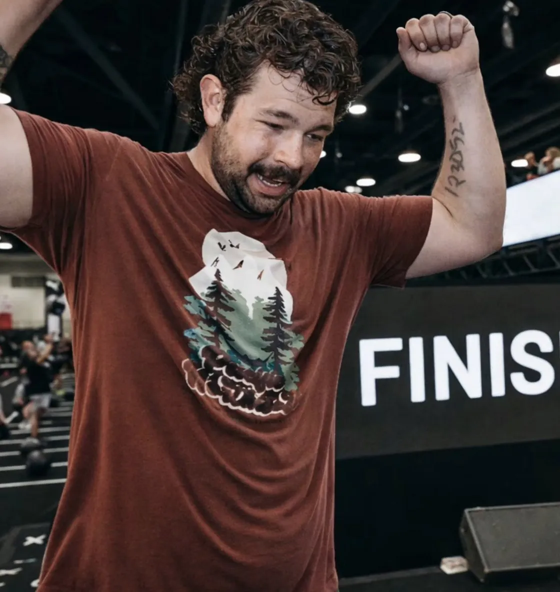 Friends celebrating a big dodgeball play in the gym