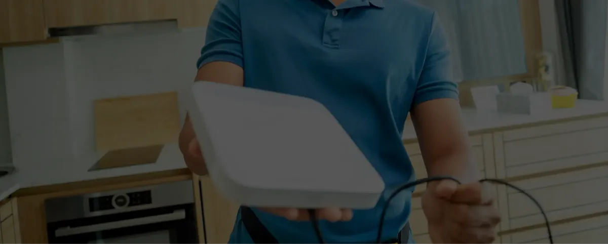 Frustrated person with buffering video on laptop, modern WiFi router nearby